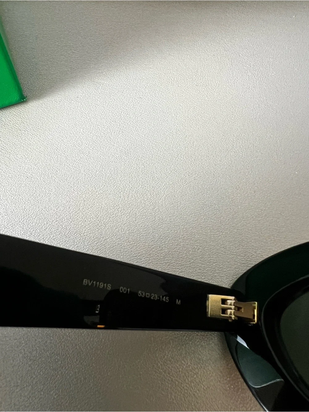 Bottega Veneta Black Oval Sunglasses with Dark Lenses
